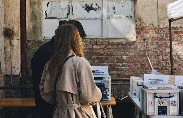 person browsing vintage records or books in a specialty NYC gift store